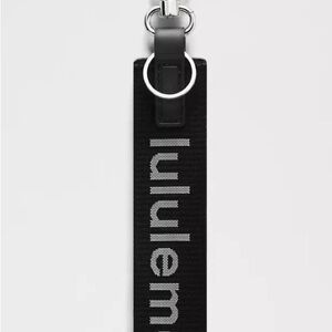 Lululemon Never Lost Keychain Dark Navy Blue Logo with Silver Hardware Key Strap